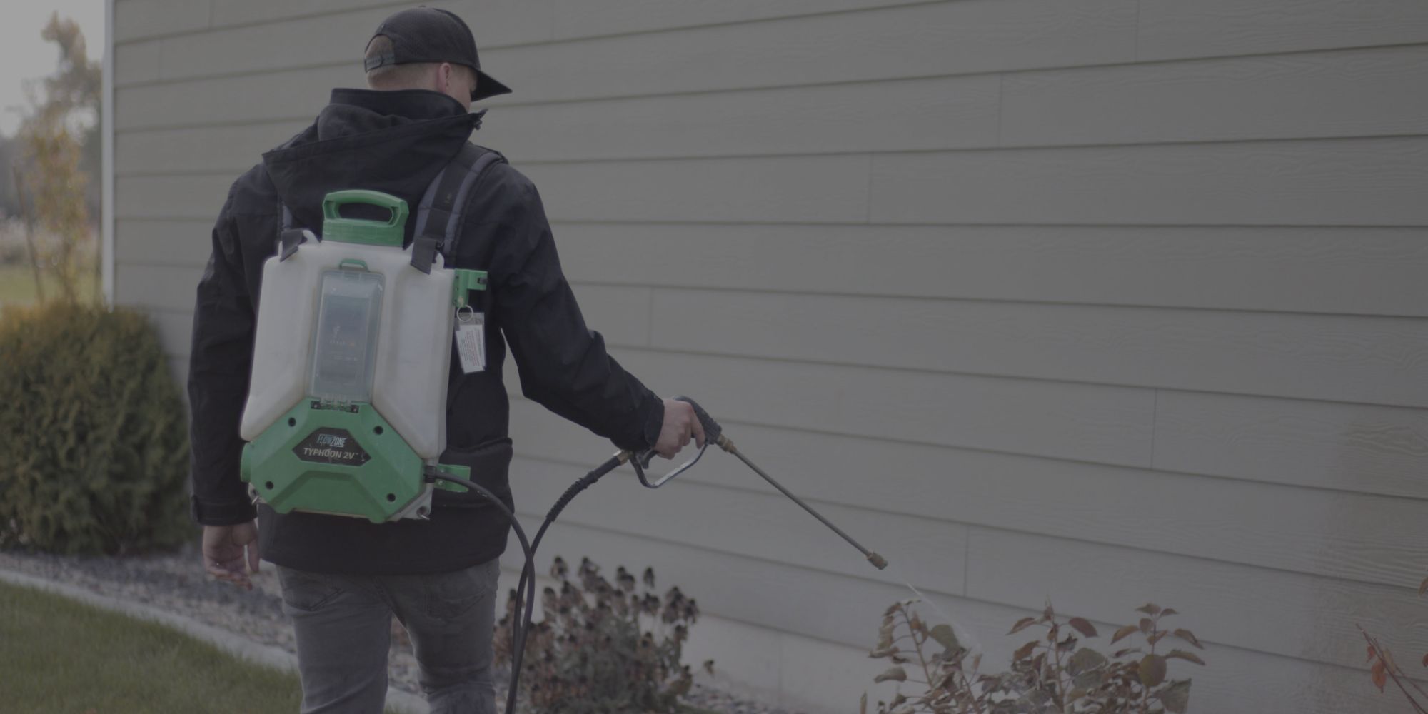 AIMVO technician spreading pest control granulation on the yard